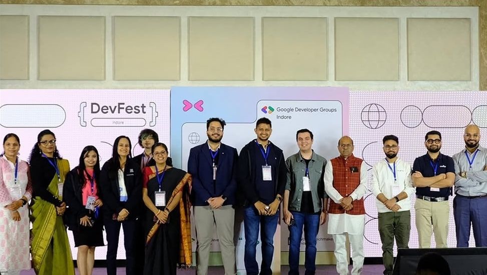 Speakers and organizers on stage at DevFest Indore, in front of DevFest Indore and Google Developer Groups Indore backdrops.